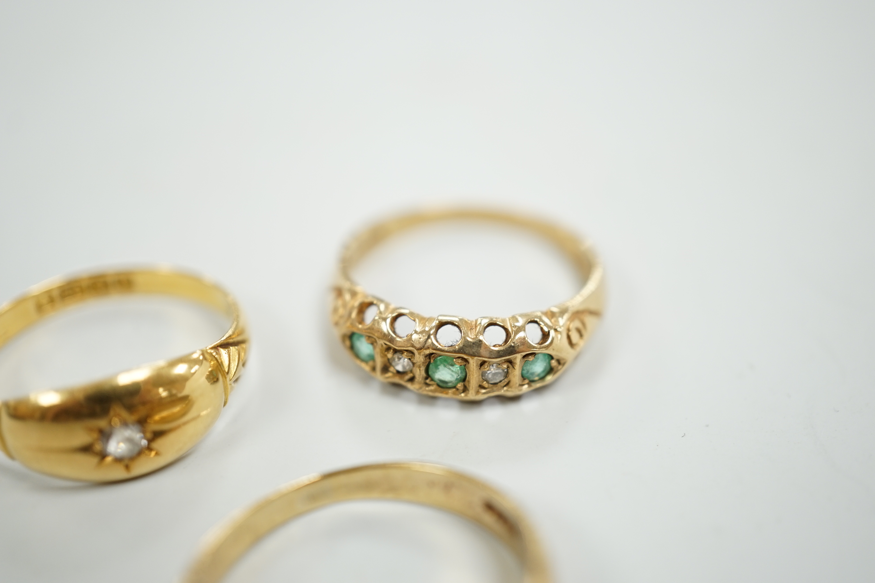 An Edwardian 18ct gold and diamond chip set ring, size M, gross weight 2.6 grams and two later 9ct gold and gem set rings, gross weight 5.5 grams.